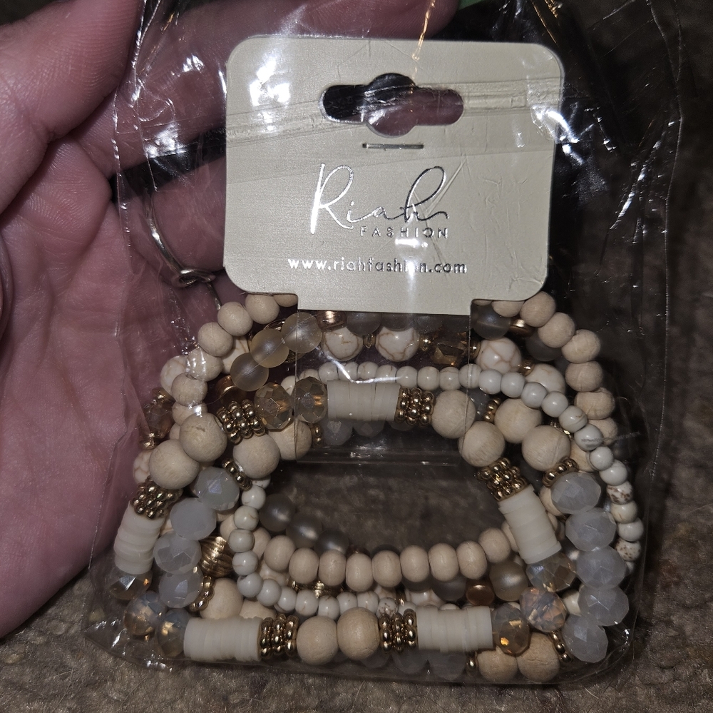 Bracelet from Riah Fashion white, cream, and wood tones, stacked Bracelet Set